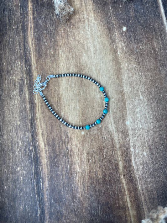 Saucer and Navajo pearl bracelet with turquoise