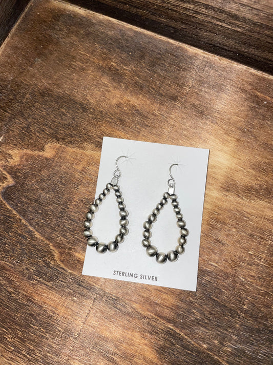 The Kassie 2.5” graduated teardrop Navajo Pearl earrings